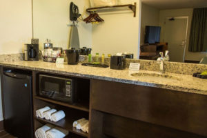 bathroom vanity with mini fridge and microwave